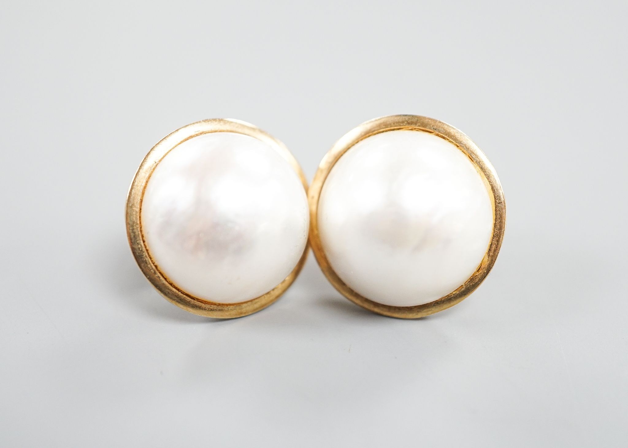 A pair of yellow metal and mabe pearl earrings, 2mm, gross weight 13.3 grams.